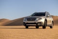 Subaru Outback standing in the middle of the desert. Namibia