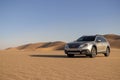 Subaru Outback standing in the middle of the desert. Namibia