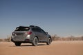 Subaru Outback standing in the middle of the Namib desert.