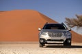 Subaru Outback stands in the middle of the Desert, next to a sand dune of Sossusvlei. 19.08.2021 Royalty Free Stock Photo