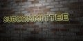 SUBCOMMITTEE - Glowing Neon Sign on stonework wall - 3D rendered royalty free stock illustration Royalty Free Stock Photo