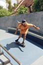 Subculture. Skater Man At Skatepark. Guy In Casual Outfit Riding On Skateboard On Concrete Ramp Royalty Free Stock Photo