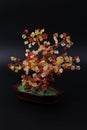 Subject shooting of a fantastic tree from red and yellow crystals.