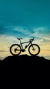 Subject Silhouette of a bike on sky background on a mountain top Royalty Free Stock Photo