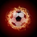 Subject Soccer ball surrounded by fiery flames in dramatic illumination Royalty Free Stock Photo