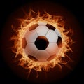 Subject Soccer ball surrounded by fiery flames in dramatic illumination Royalty Free Stock Photo