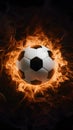 Subject Soccer ball surrounded by fiery flames in dramatic illumination Royalty Free Stock Photo