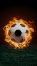 Subject Soccer ball surrounded by fiery flames in dramatic illumination Royalty Free Stock Photo