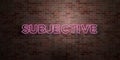 SUBJECTIVE - fluorescent Neon tube Sign on brickwork - Front view - 3D rendered royalty free stock picture Royalty Free Stock Photo