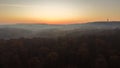 Sublime scenery of golden sunset above misty mountains