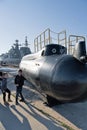 Kronstadt, Russia, August 2018. Children play at a small submarine on the pier.