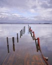 Submerged lagoon pier with red rope