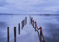 Submerged pier at blue hour on winter