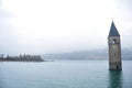 Submerged tower of reschensee church deep in Resias Lake of Bolzano or bozen at Italy Royalty Free Stock Photo