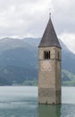 Submerged tower of reschensee church deep in Resias Lake in Trentino-Alto valley Royalty Free Stock Photo