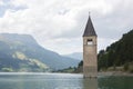 Submerged tower of reschensee church deep in Resias Lake in Trentino-Alto valley Royalty Free Stock Photo