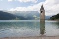 Submerged tower of reschensee church deep in Resias Lake in Trentino-Alto valley Royalty Free Stock Photo