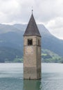 Submerged tower of reschensee church deep in Resias Lake in Trentino-Alto valley Royalty Free Stock Photo