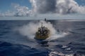 submersible approaches volcanic seamount, with steam and smoke venting from the vents