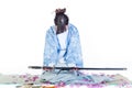 Submissive geisha in blue kimono with katana Royalty Free Stock Photo