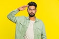 Subordinate responsible Indian man giving salute listening to order as soldier, following discipline Royalty Free Stock Photo