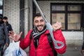 Iraqi refugee, disabled and smiling, waiting to cross the Serbia-Hungary border at Subotica Serbia bus station Royalty Free Stock Photo