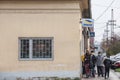 Crowd of people in a waiting queue in front of a post office of Posta srbije waiting to enter respecting social distancing Royalty Free Stock Photo