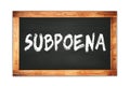 SUBPOENA text written on wooden frame school blackboard