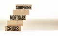 SUBPRIME MORTGAGE CRISIS - words on wooden blocks.