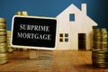 Subprime mortgage plate and model of home