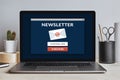 Subscribe newsletter concept on laptop screen on modern desk Royalty Free Stock Photo