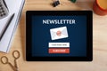Subscribe newsletter concept on tablet screen with office object Royalty Free Stock Photo