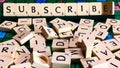 Subscribe word written on scrabble for content creation Royalty Free Stock Photo