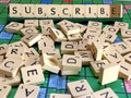 Subscribe word written on scrabble for content creation Royalty Free Stock Photo