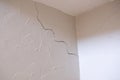 Subsidence crack in corner of wall and ceiling Royalty Free Stock Photo