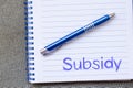 Subsidy write on notebook Royalty Free Stock Photo