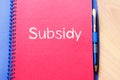 Subsidy write on notebook Royalty Free Stock Photo