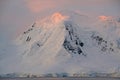 Subtle alpenglow lights snowy mountain