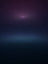 A subtle gradient background transitioning from deep indigo and navy blue to a soft purple with a bright, diffused light source at Royalty Free Stock Photo