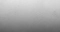 Subtle Grey Gradient Background with Fine Speckled Texture and Faint Dust Particles Royalty Free Stock Photo