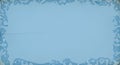 Subtle icy blue border frames a soft light blue background with a textured appearance Royalty Free Stock Photo