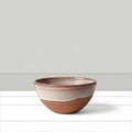 A subtle shadow beneath the bowl highlighting its round shape and Royalty Free Stock Photo