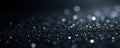 Subtle silver glitter scattered on black backdrop, shimmer, abstract background Royalty Free Stock Photo