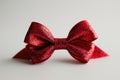 A Subtle Yet Striking Image A Vibrant Red Bow Against A Clean White Background