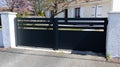 Suburb home large grey dark metal aluminum black portal house gate slats garden access door