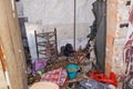 Suburban home wooden storage utility unit shed with miscellaneous stuff on shelves, bikes, exercise machine, ladder, garden tools Royalty Free Stock Photo