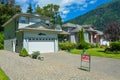 Suburban house with mountain view and blue sky background for sale Royalty Free Stock Photo