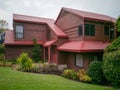 suburban house with red metal roof in Howick