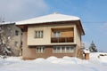 Suburban house covered with freshly fallen snow on sunny winter day Royalty Free Stock Photo