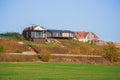 Suburban luxury real estate, modern cottage on a green hill